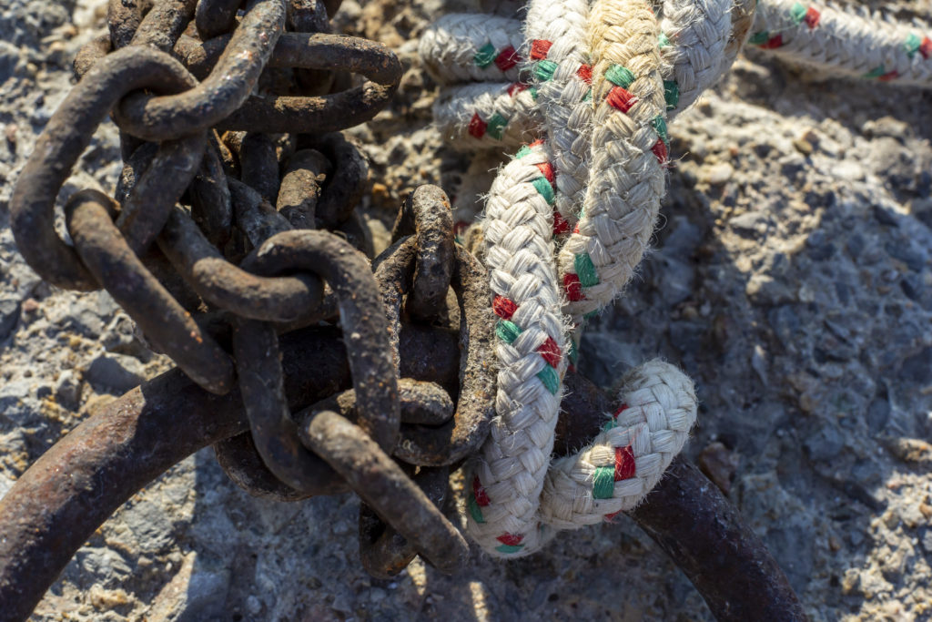 rusty chain and rope tied to the mooring ring